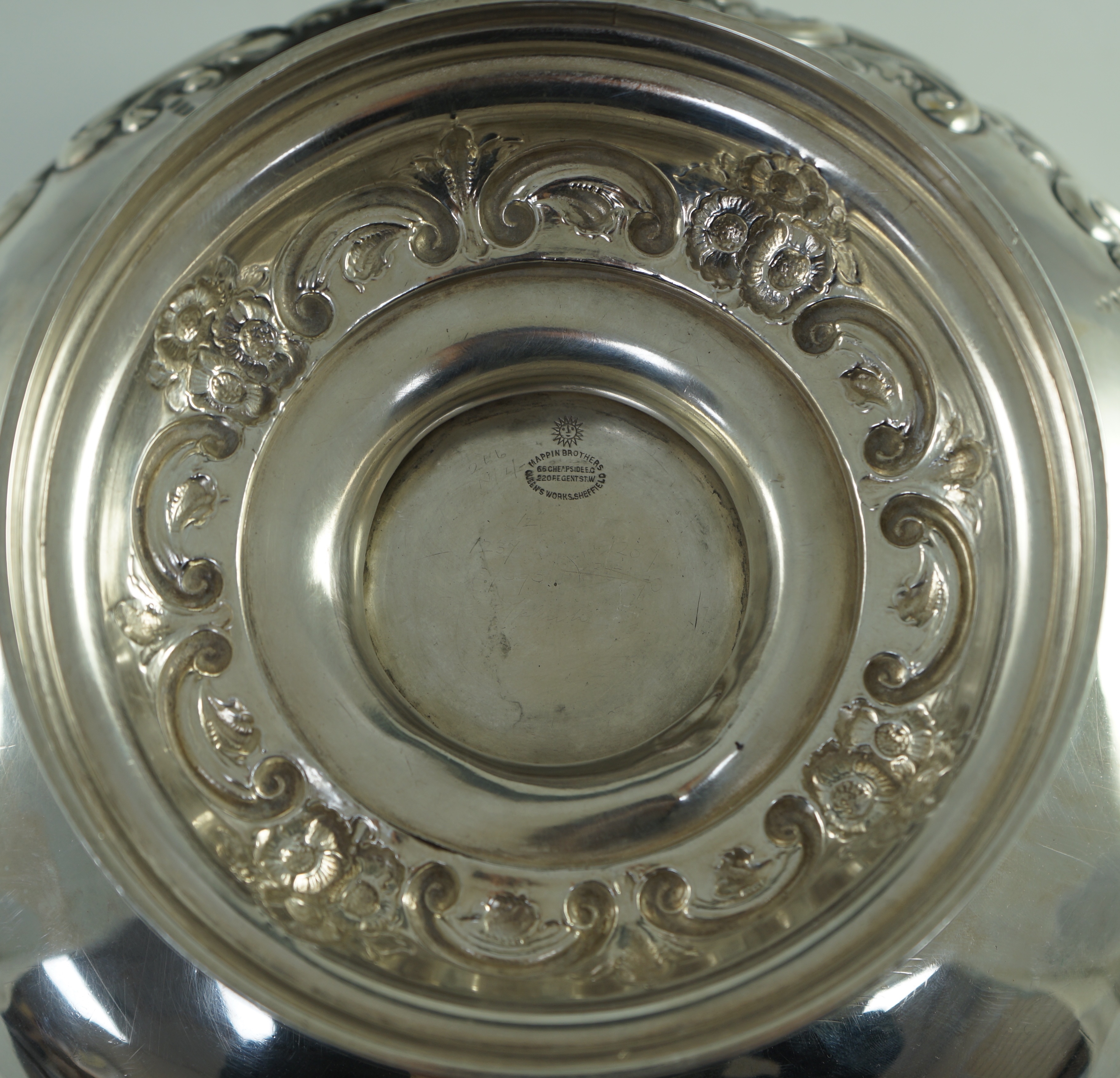 A late Victorian embossed silver pedestal punch bowl by Mappin Brothers (a.f.)